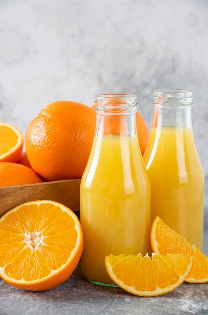 Orange fruits in glass on table