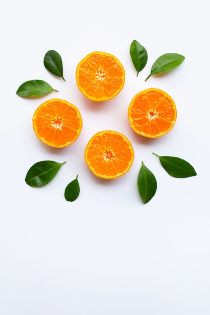 Orange fruits with  leaves on white background. 