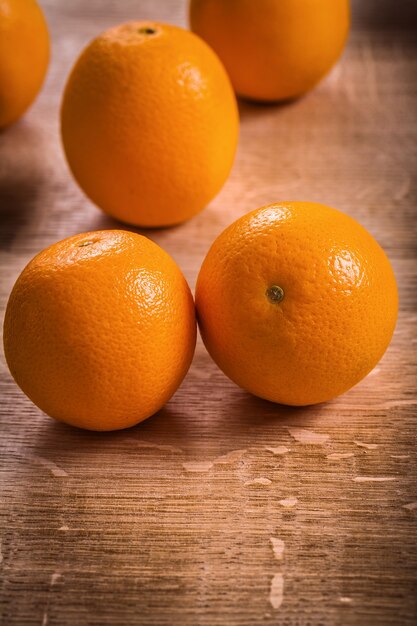 Orange fruits on wooden board