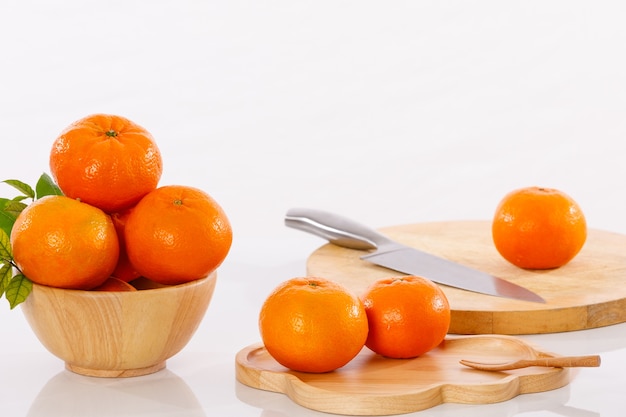 orange goldern and knife  on the white table