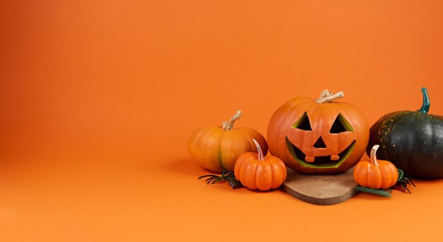 オレンジ色のハロウィンの背景にはハンドメイドのコウモリと南瓜が描かれています ハロウィンのコンセプトは高解像度です