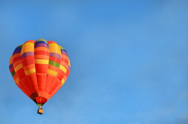 Orange hot air balloon in the sky copy space