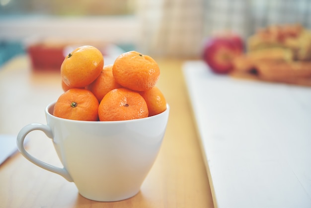 Photo the orange is in the cup ready to be a component of the food.