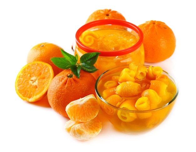 Orange jam with zest and tangerines isolated on white
