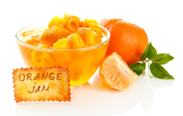 Orange jam with zest and tangerines isolated on white