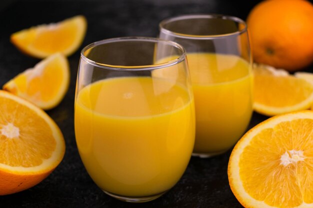 Orange juice in a black background.Close-up.