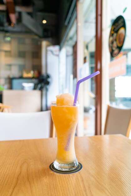 orange juice blend smoothie glass in cafe restaurant