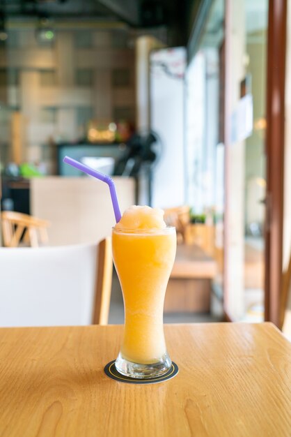 orange juice blend smoothie glass in cafe restaurant