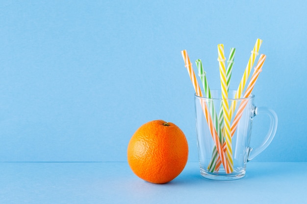 Orange juice on a blue pastel isolated