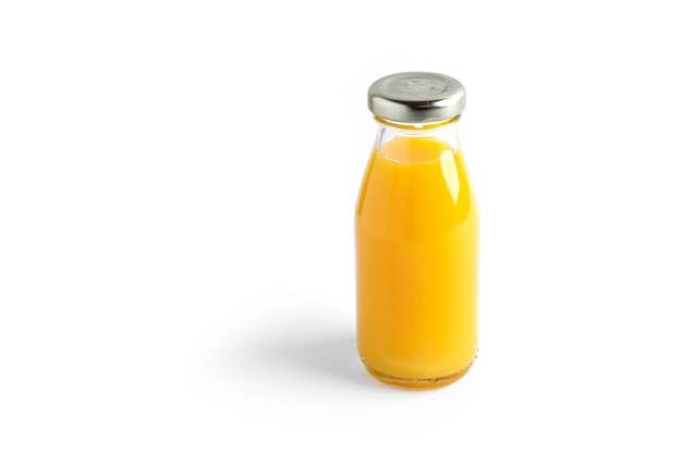 Orange juice in bottle isolated on white.