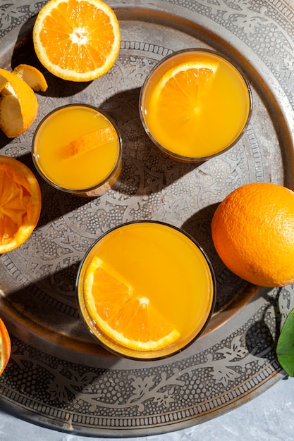 Orange juice from above on gray table.