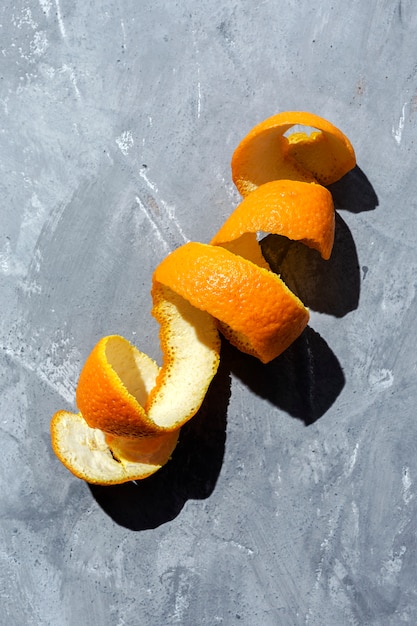 Orange juice from above on gray walls.