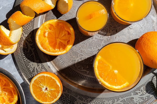 Orange juice from above on gray walls.