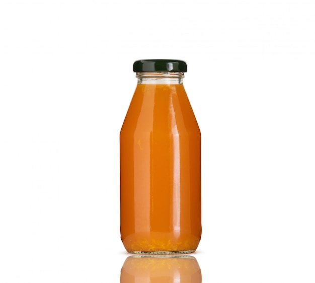 orange juice in glass bottle isolated