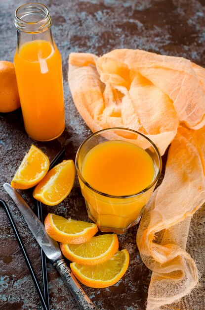 Orange juice in a glass and pieces