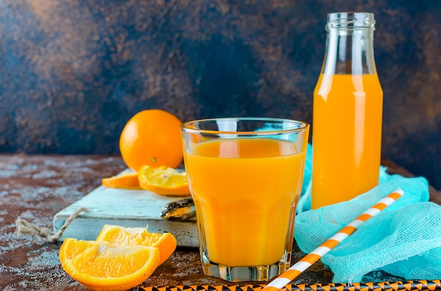 Orange juice in a glass and pieces