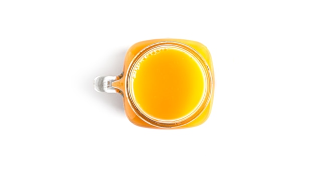 Orange juice in glass on white