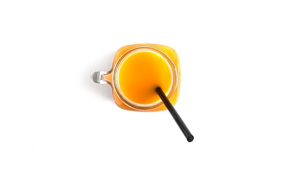 Orange juice in glass on white