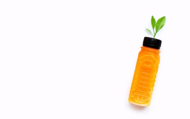 Orange juice in plastic bottle on white background