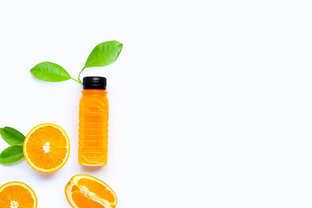 Orange juice in plastic bottle with fruit on white background