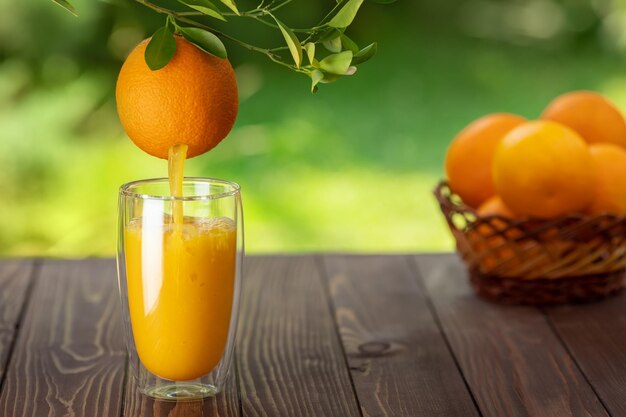 Orange juice pouring into glass