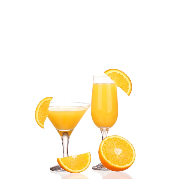 Orange juice and slices of orange isolated on white