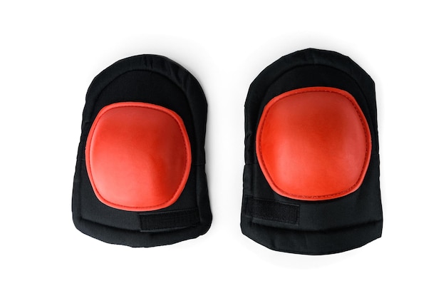 Orange knee pads isolated on white background