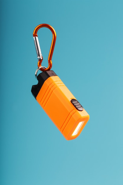 Orange led flashlight with a carabiner