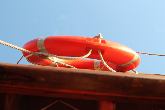 An orange life preserver with the word life preserver on it.