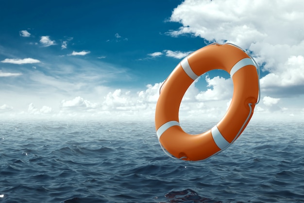 Photo orange lifebuoy on the water. the concept of help, rescue, drowning, storm. copy space.