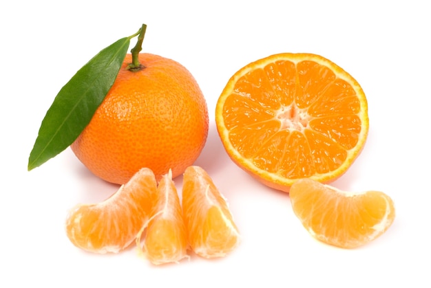 Orange mandarins with green leaf isolated on white