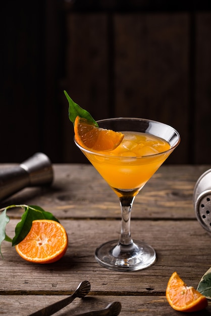 Orange martini cocktail in rustic style