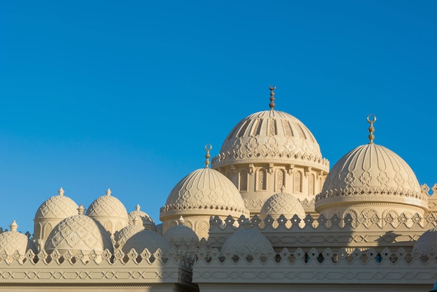 Orange Mosque Domes on blue sky