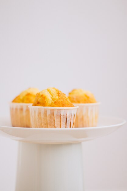 Orange muffins in a cake stand