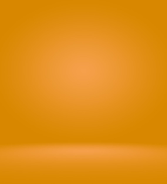 Orange photographic studio background vertical with soft vignette. soft gradient background. painted canvas studio backdrop