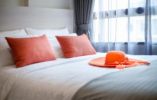 Orange pillows on the bed