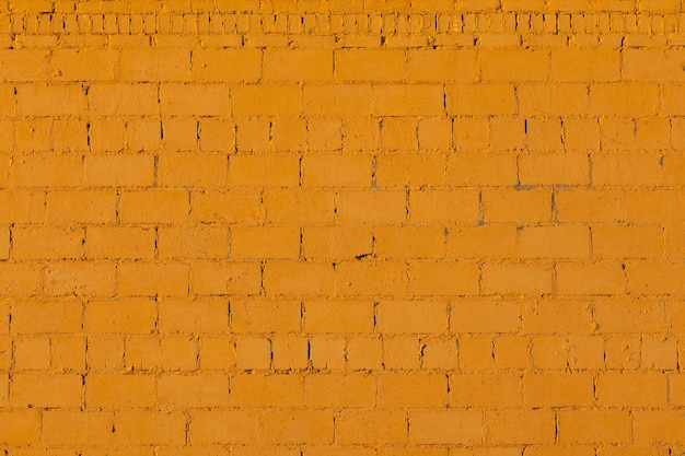 Orange plaster rough brick outside wall texture