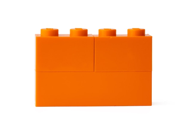 Orange plastic building blocks isolated on white