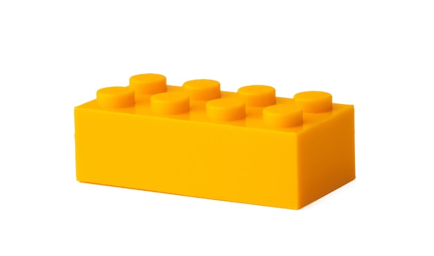 Photo orange plastic building blocks isolated on white