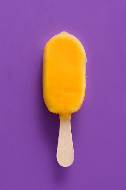 Orange popsicle on violet