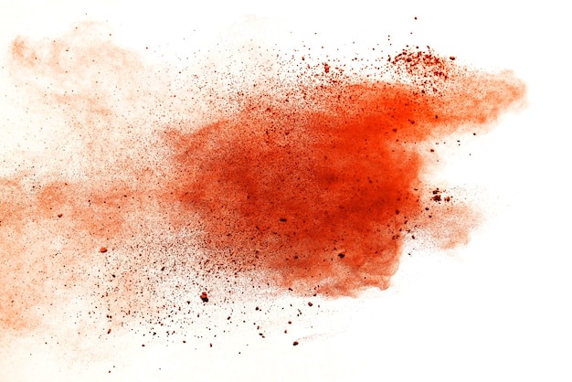 Orange powder explosion isolated on white  background