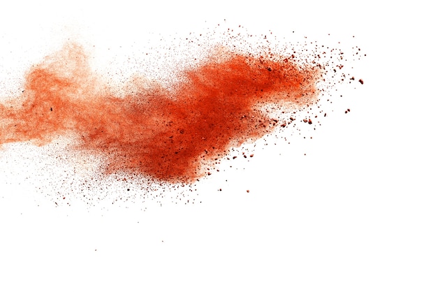 Orange powder explosion isolated on white  background