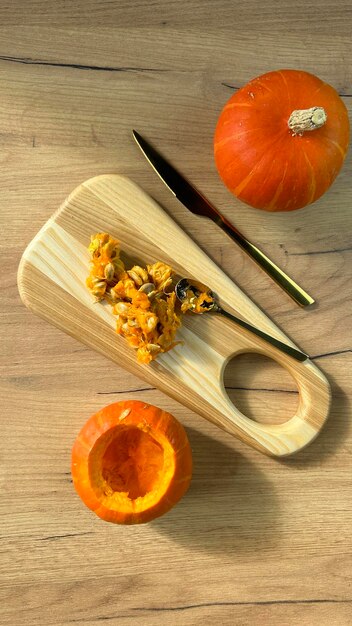 Orange pumpkins on a wooden table preparation for halloween