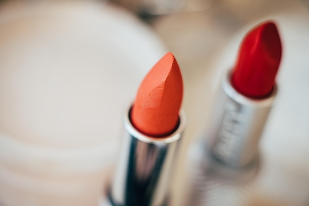 Orange and red lipsticks closeup real makeup tools macro