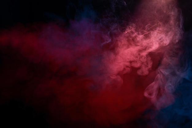 Orange and red steam on a black background