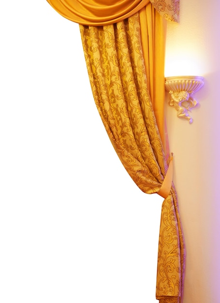 Photo orange silk curtains isolated on white background