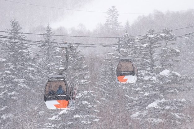 Orange ski lifts in the snow