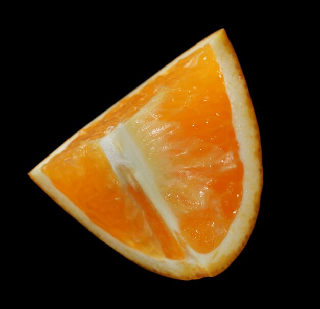 Photo orange slice on black background