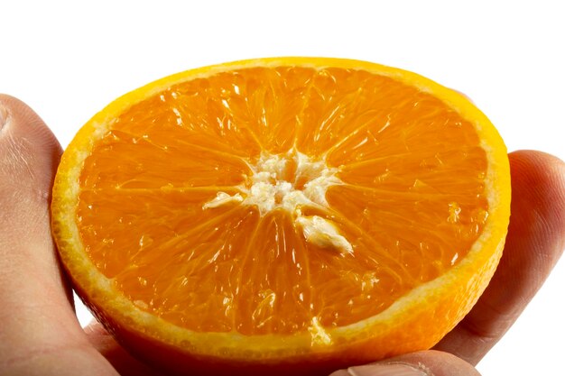 Orange slice in hand isolated on white background