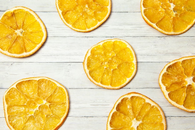 Orange slice on wood background, top view